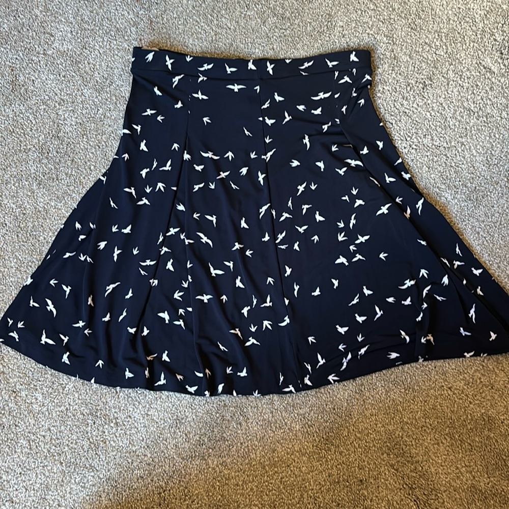 Navy blue skirt with white bird design.